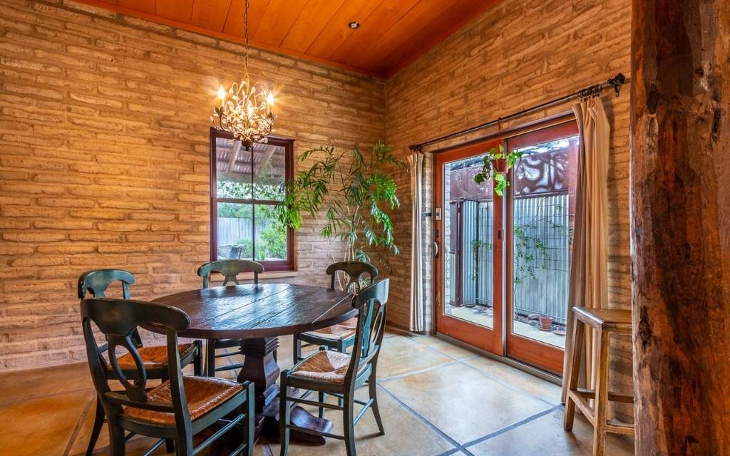 This mud adobe home built in the early 2000s exudes warmth and charm.